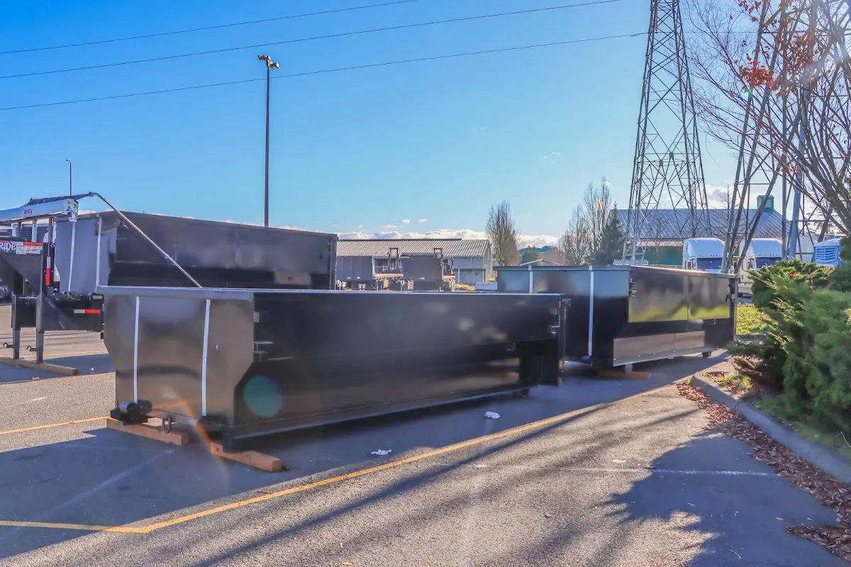 Roll-off dumpster ready for waste disposal at job site for 6 Yard Dumpster Rental in Dracut
